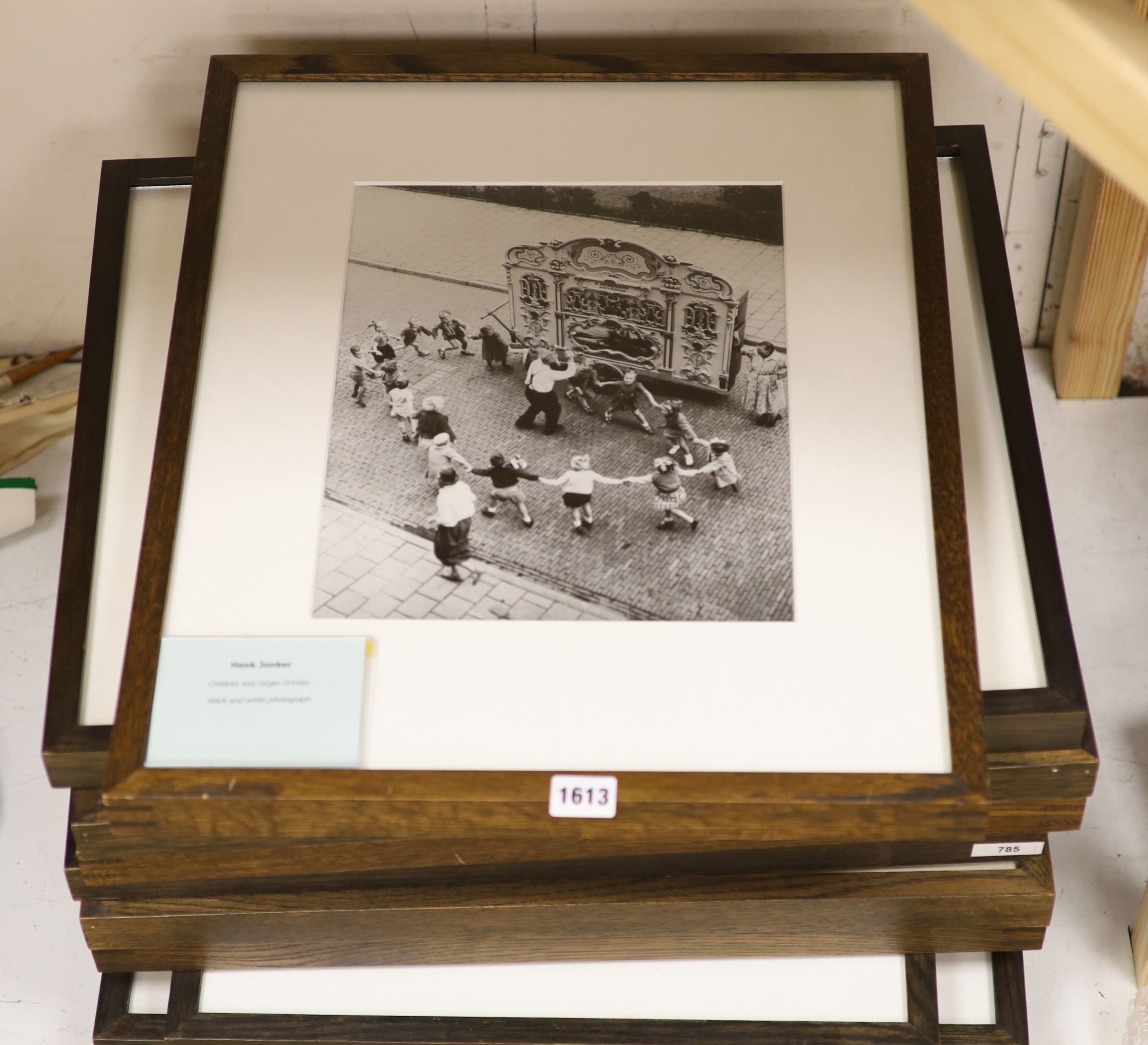 A collection of modern black and white photographs: Henk Jonker, Children and organ grinder, Roger Mayne, Please Mr Take My Photo, Unknown, The Village Hall, Christian Pizal